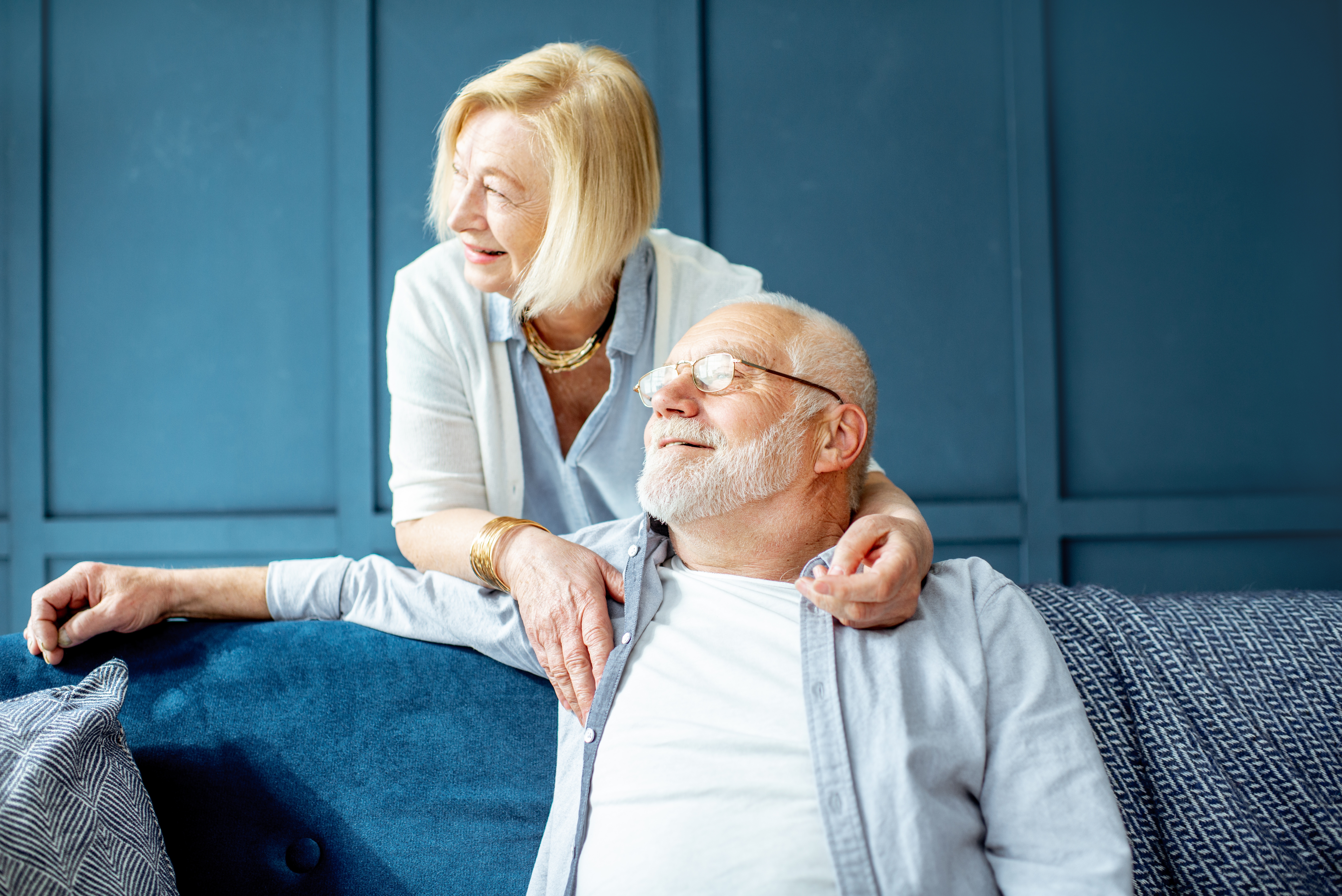 Lovely senior couple on the couch at home