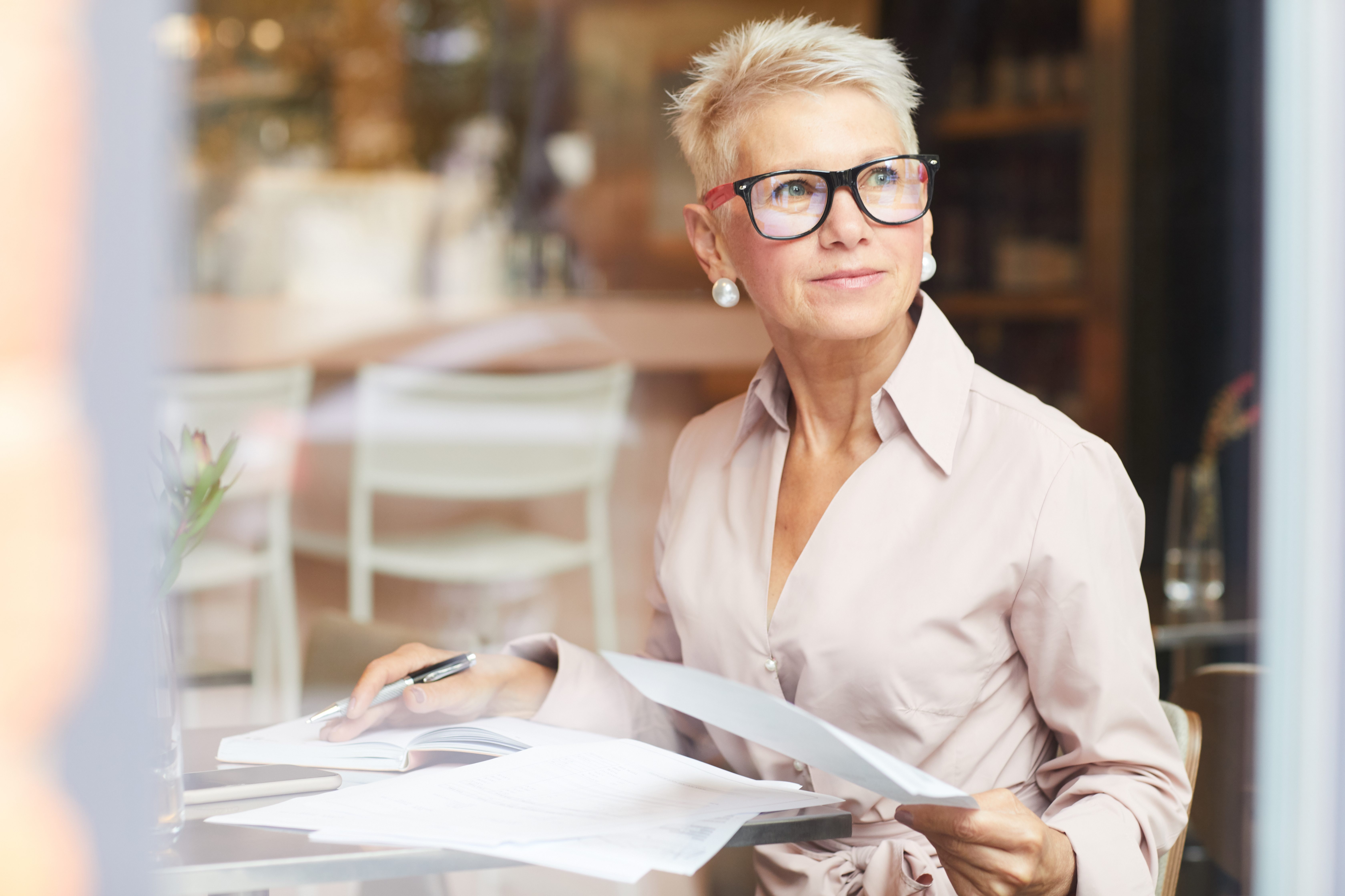 Mature woman working with documents