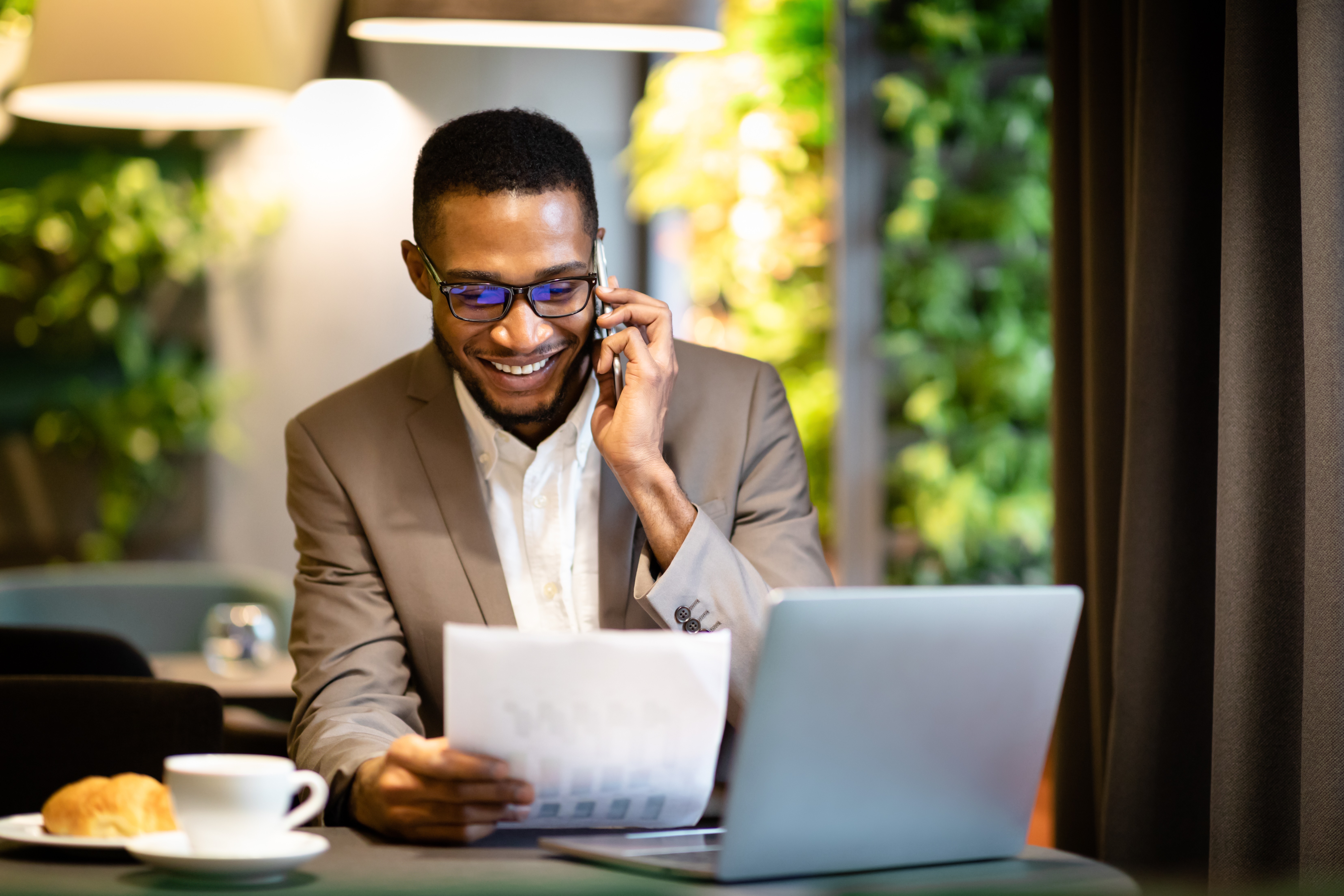 Portrait of black businessman making phone call